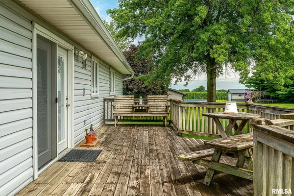 a backyard of a house with outdoor seating