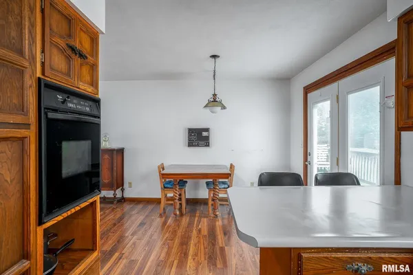 a kitchen with stainless steel appliances granite countertop a sink and a microwave