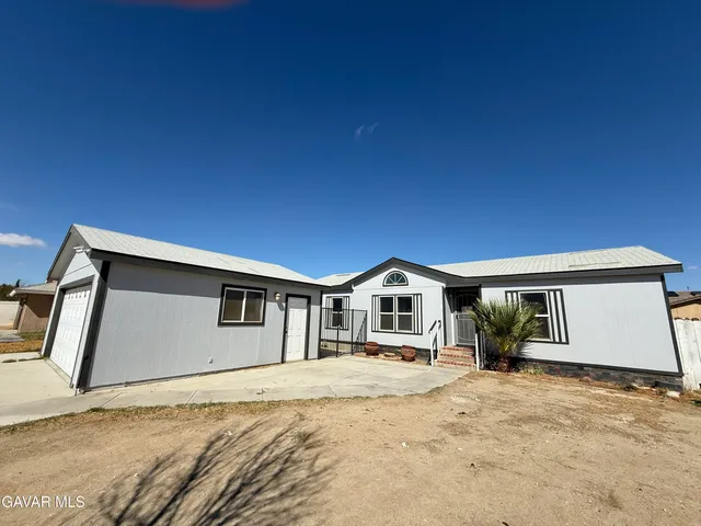 a view of house with yard