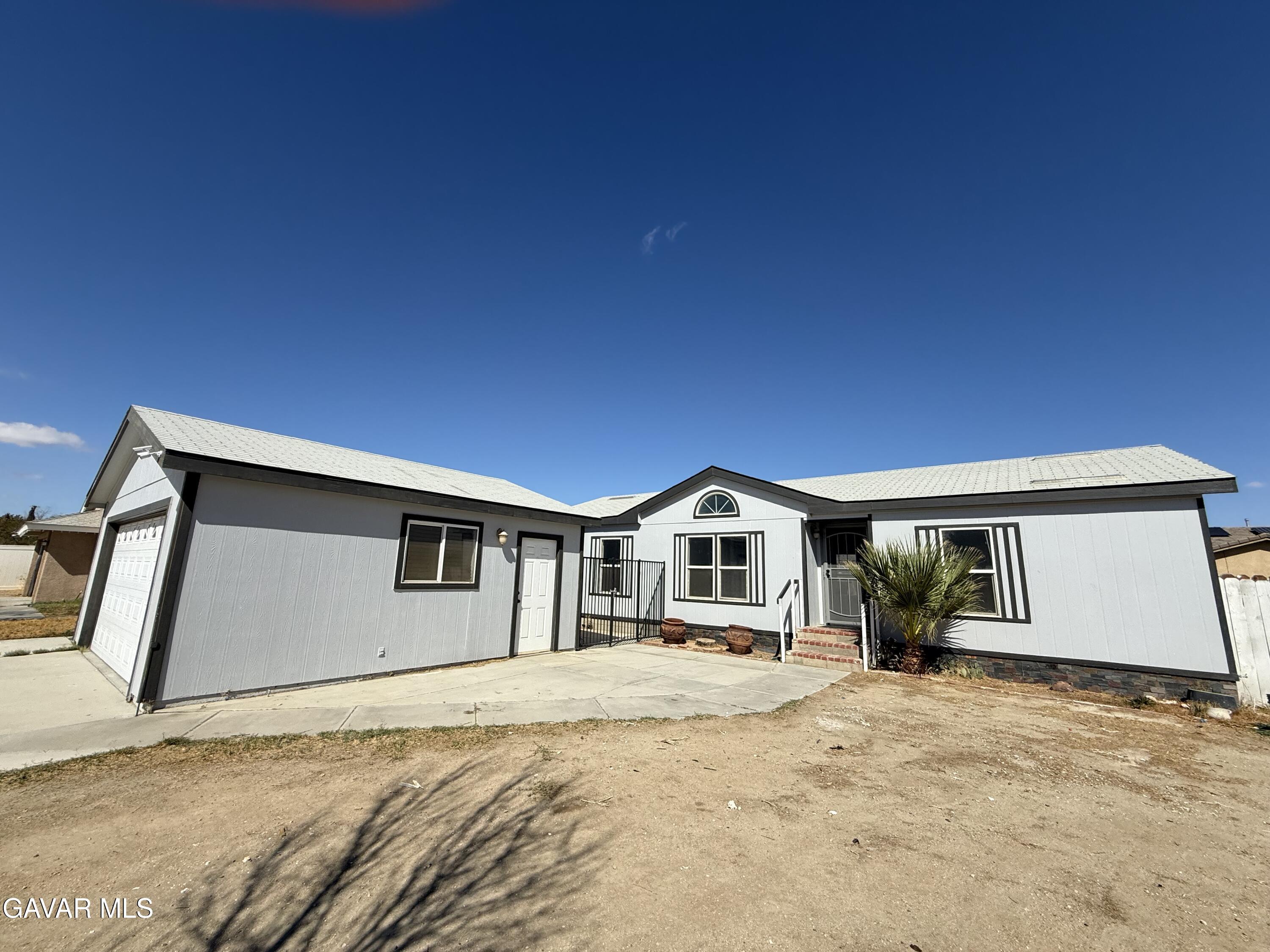 1365 Richfield Avenue Rosamond, CA 93560 - Photo 1 of 17 a view of house with yard