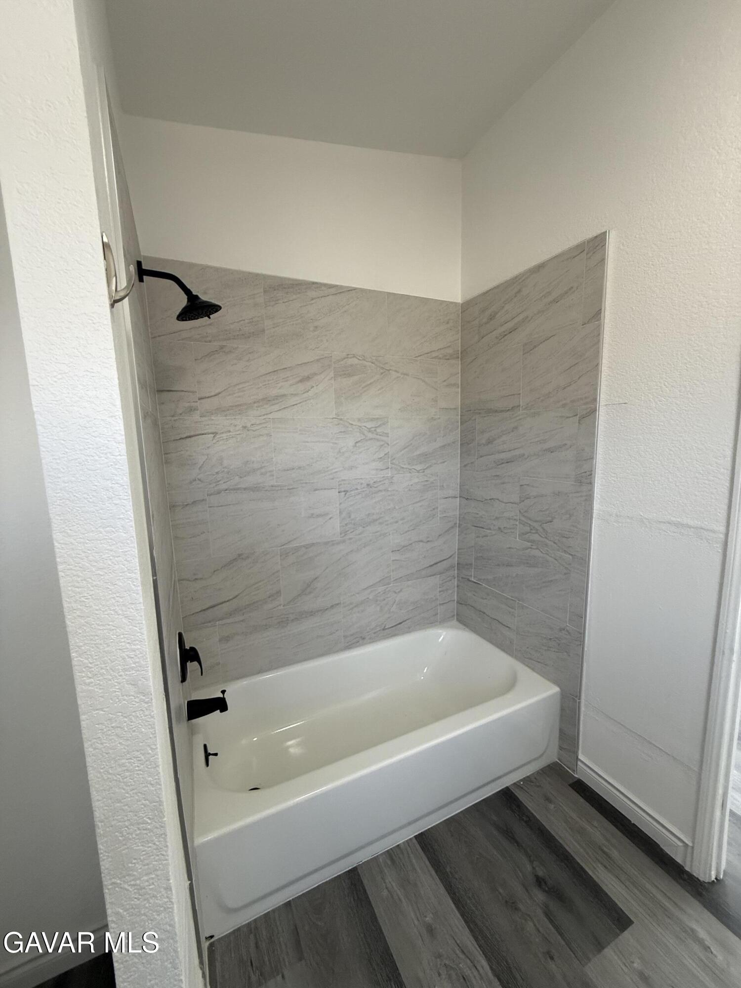 1365 Richfield Avenue Rosamond, CA 93560 - Photo 11 of 17 a bathroom with a bathtub