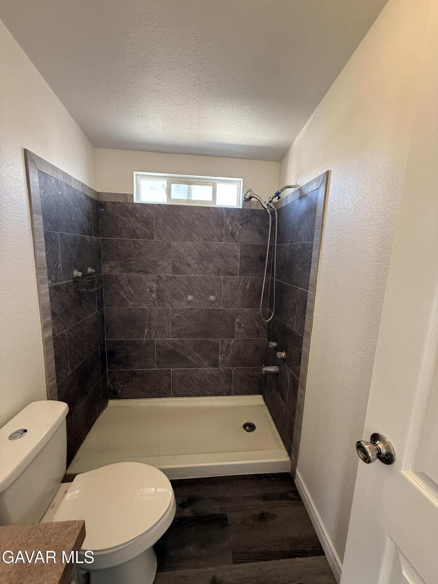 1365 Richfield Avenue Rosamond, CA 93560 - Photo 12 of 17 a bathroom with a sink and a mirror