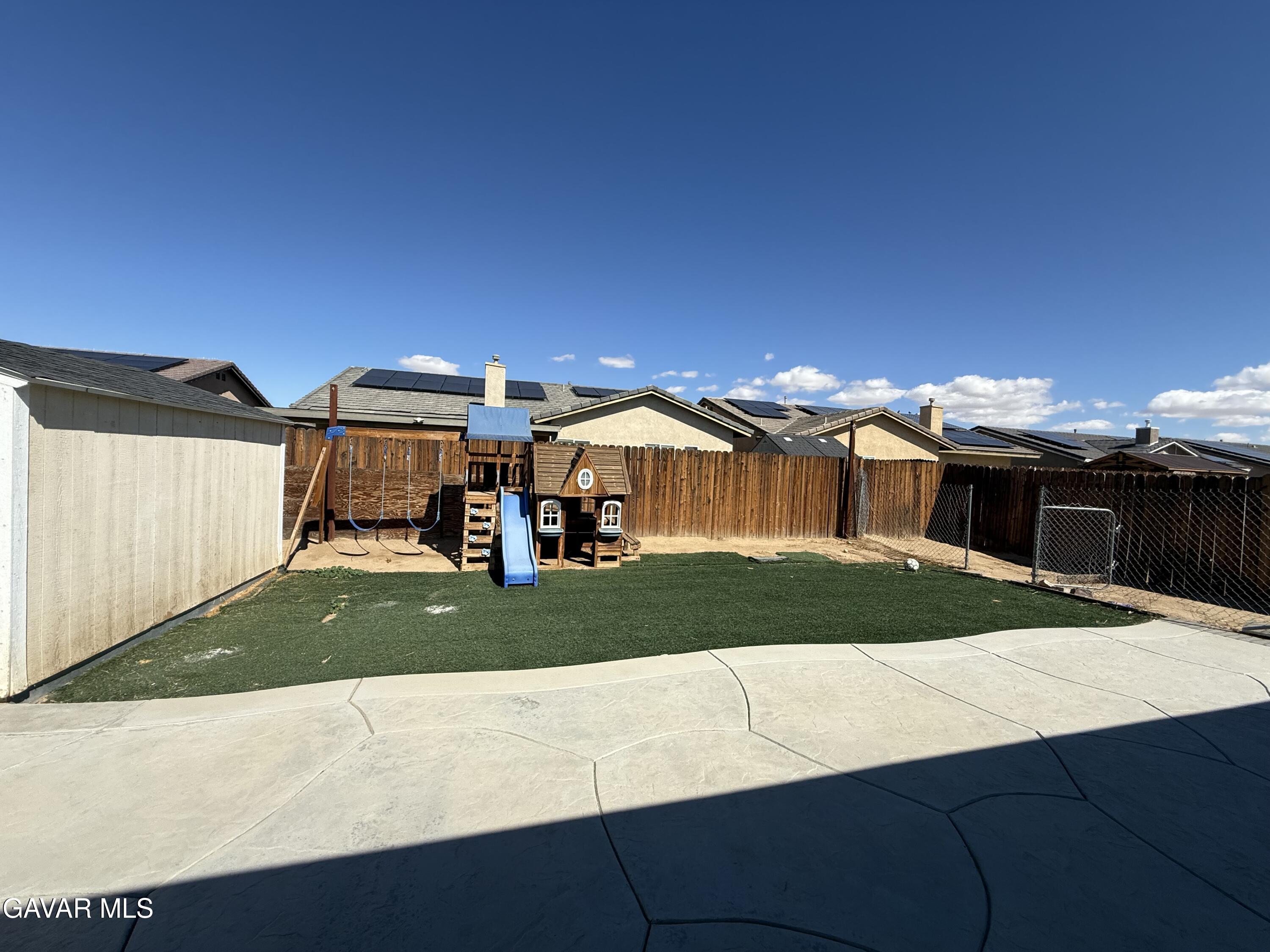 1365 Richfield Avenue Rosamond, CA 93560 - Photo 15 of 17 a front view of a house with a yard
