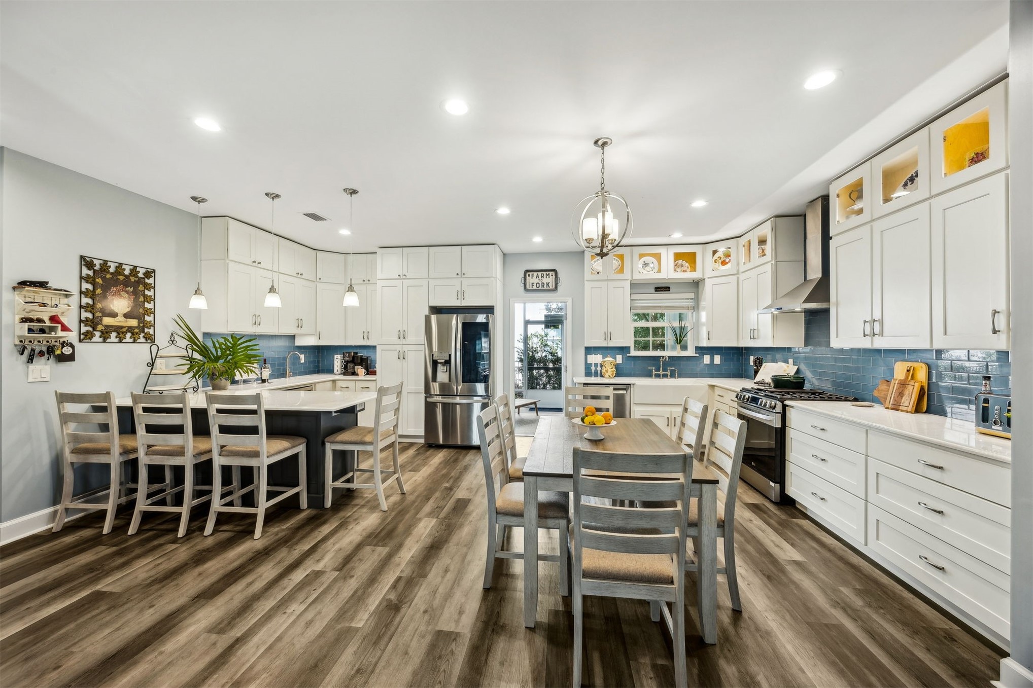 307 Elm Street Fernandina Beach, FL 32034 - Photo 11 of 35 a large kitchen with a table and chairs