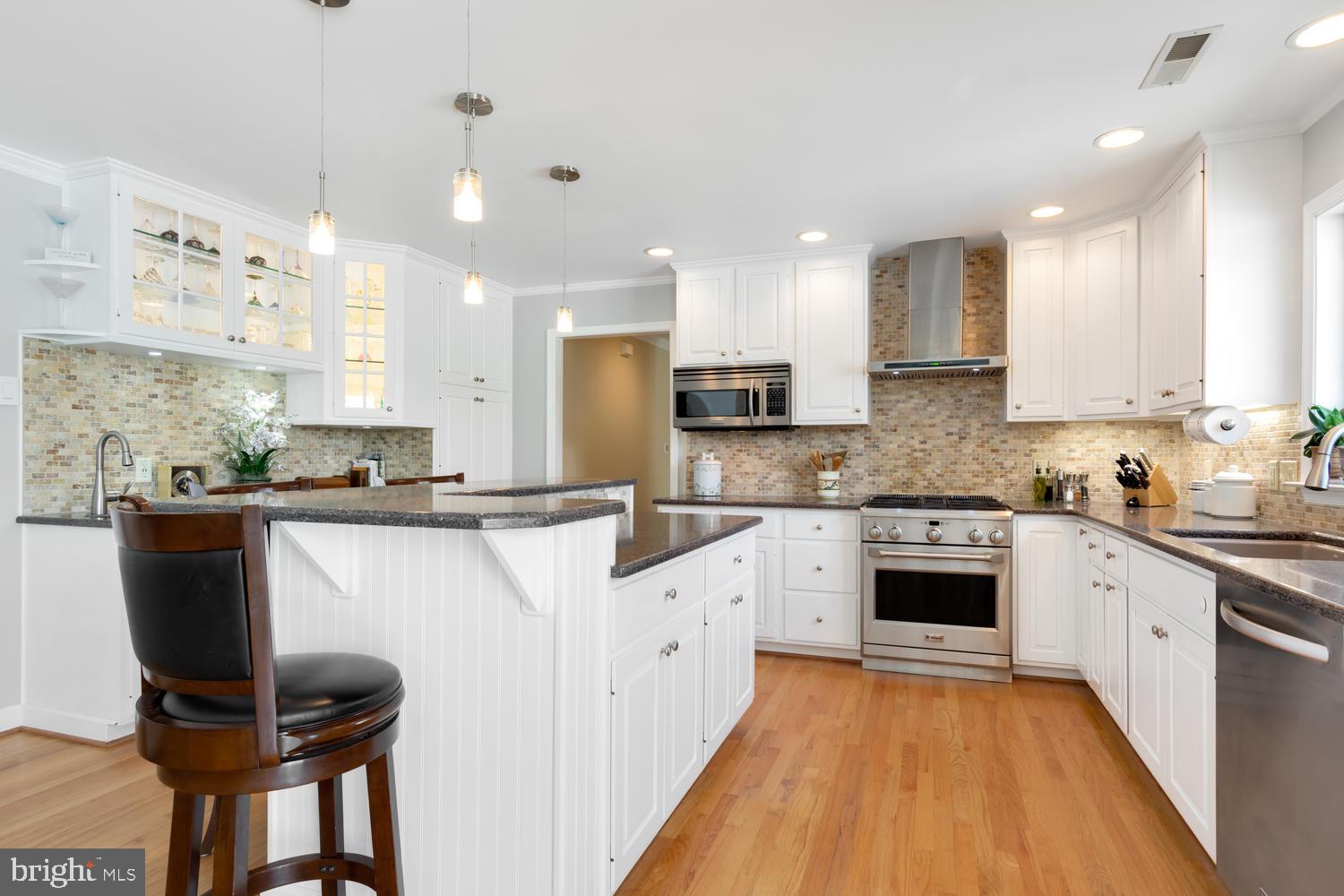 25474 Chance Farm Road St. Michaels, MD 21663 - Photo 24 of 52 Kitchen offers granite counters & tiled backsplash