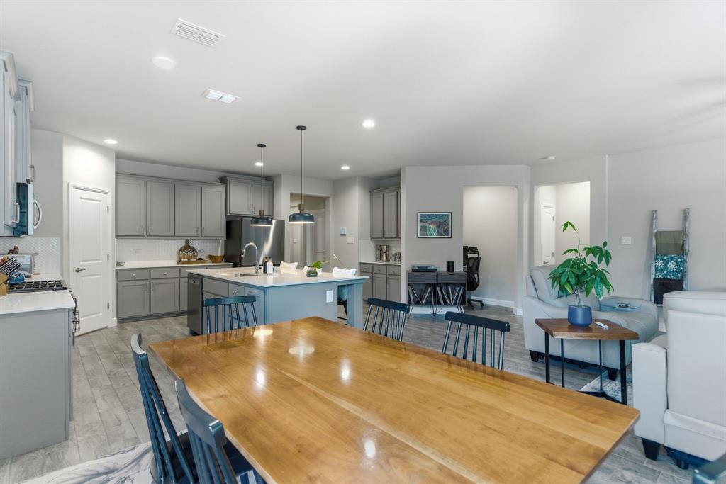 5621 Round Hl Road Denton, TX 76210 - Photo 10 of 27 a kitchen with a table and chairs in it