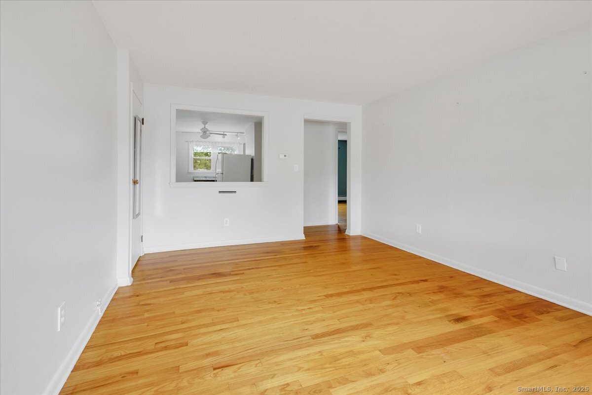 63 Maynard Street Middletown, CT 06457 - Photo 11 of 28 a view of empty room with wooden floor