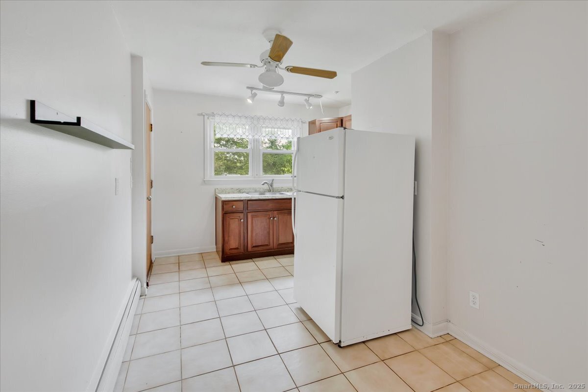 63 Maynard Street Middletown, CT 06457 - Photo 16 of 28 a view of kitchen with windows and cabinet