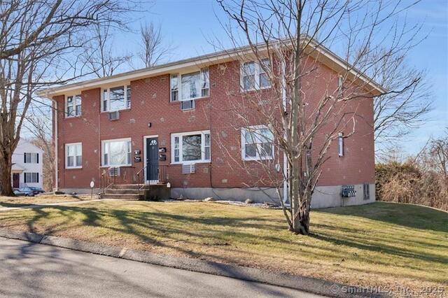 63 Maynard Street Middletown, CT 06457 - Photo 2 of 28 a view of a house with a yard