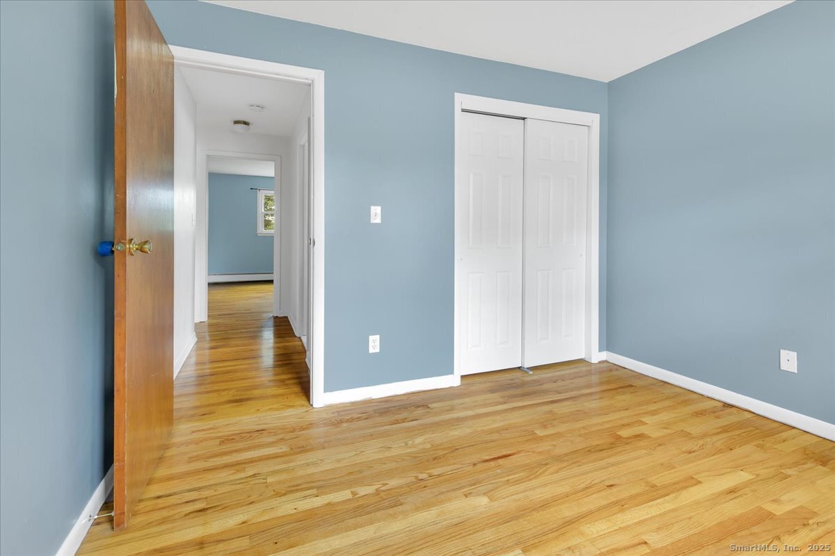 63 Maynard Street Middletown, CT 06457 - Photo 28 of 28 a view of an empty room with wooden floor