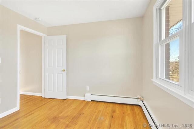 63 Maynard Street Middletown, CT 06457 - Photo 6 of 28 a view of a room with a wooden floor and a window