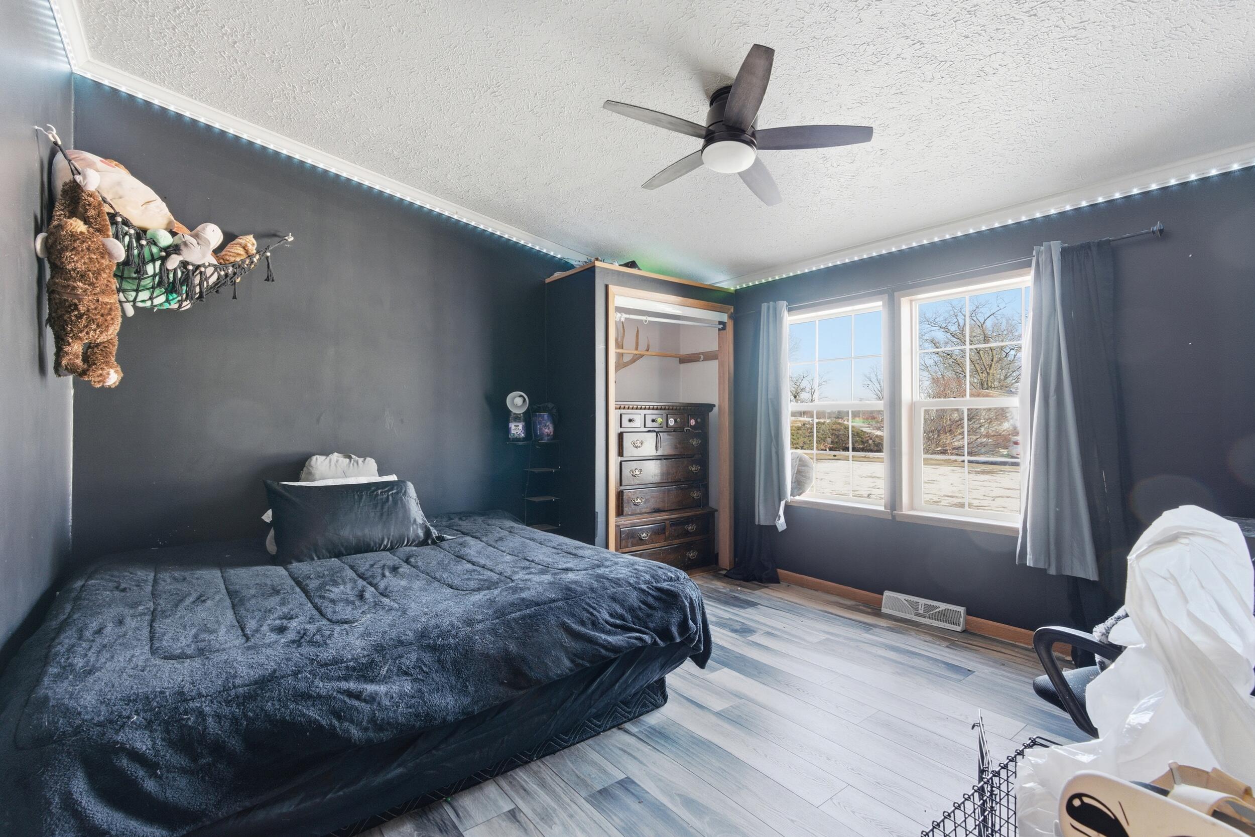 4827 East 994 North Demotte, IN 46310 - Photo 12 of 25 a bedroom with a large bed and a window
