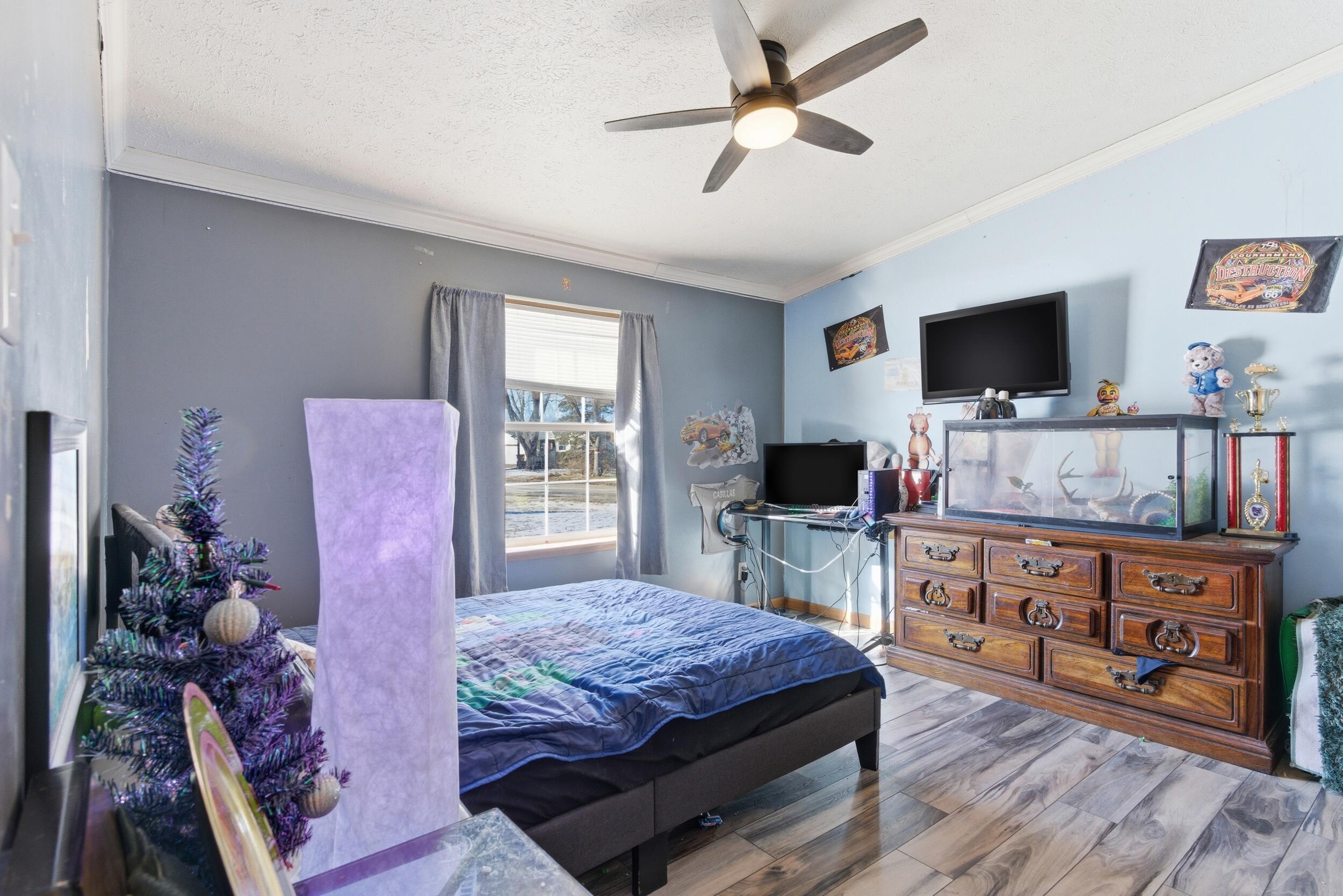 4827 East 994 North Demotte, IN 46310 - Photo 14 of 25 a living room with furniture and a flat screen tv