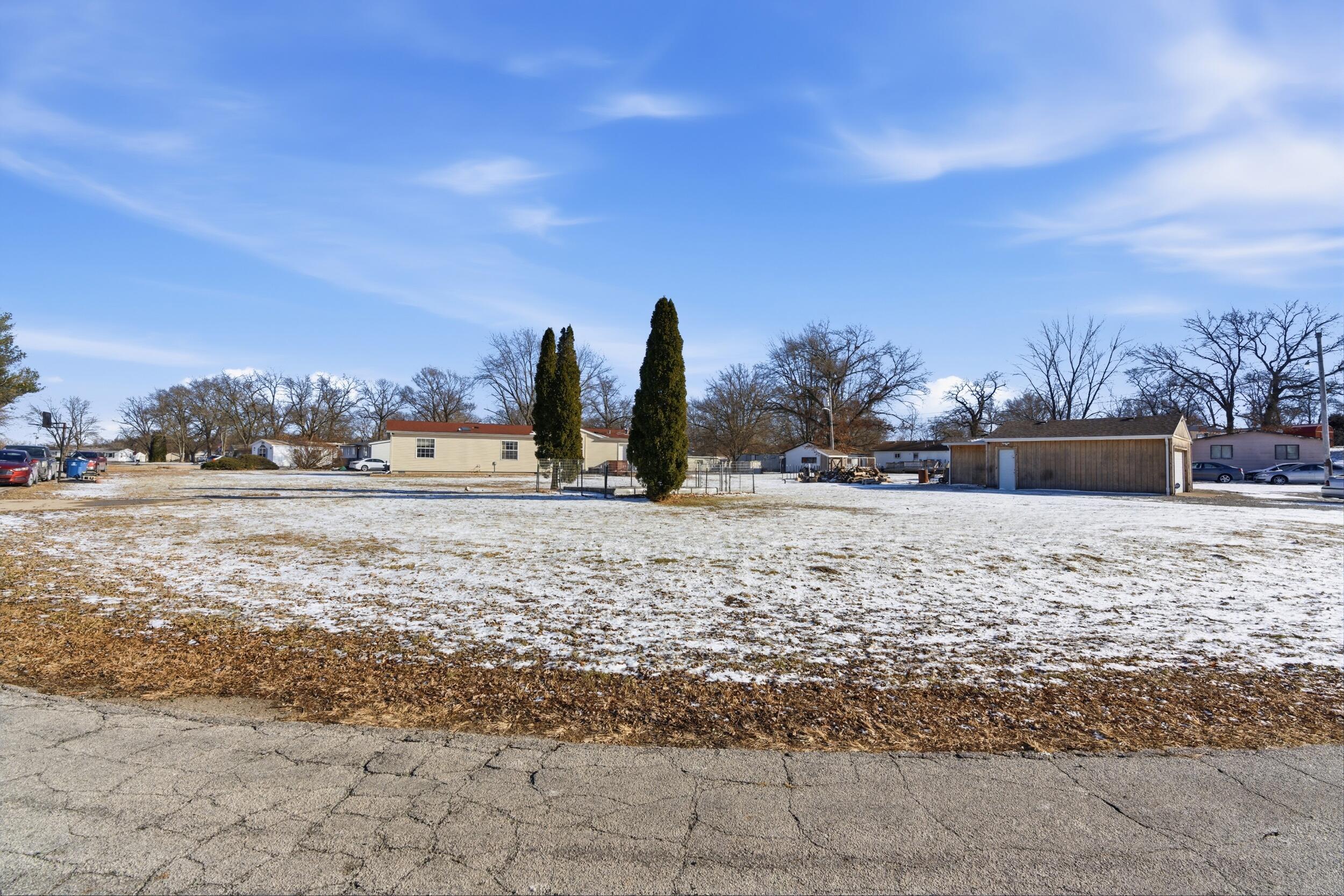 4827 East 994 North Demotte, IN 46310 - Photo 22 of 25 a view of outdoor space with trees
