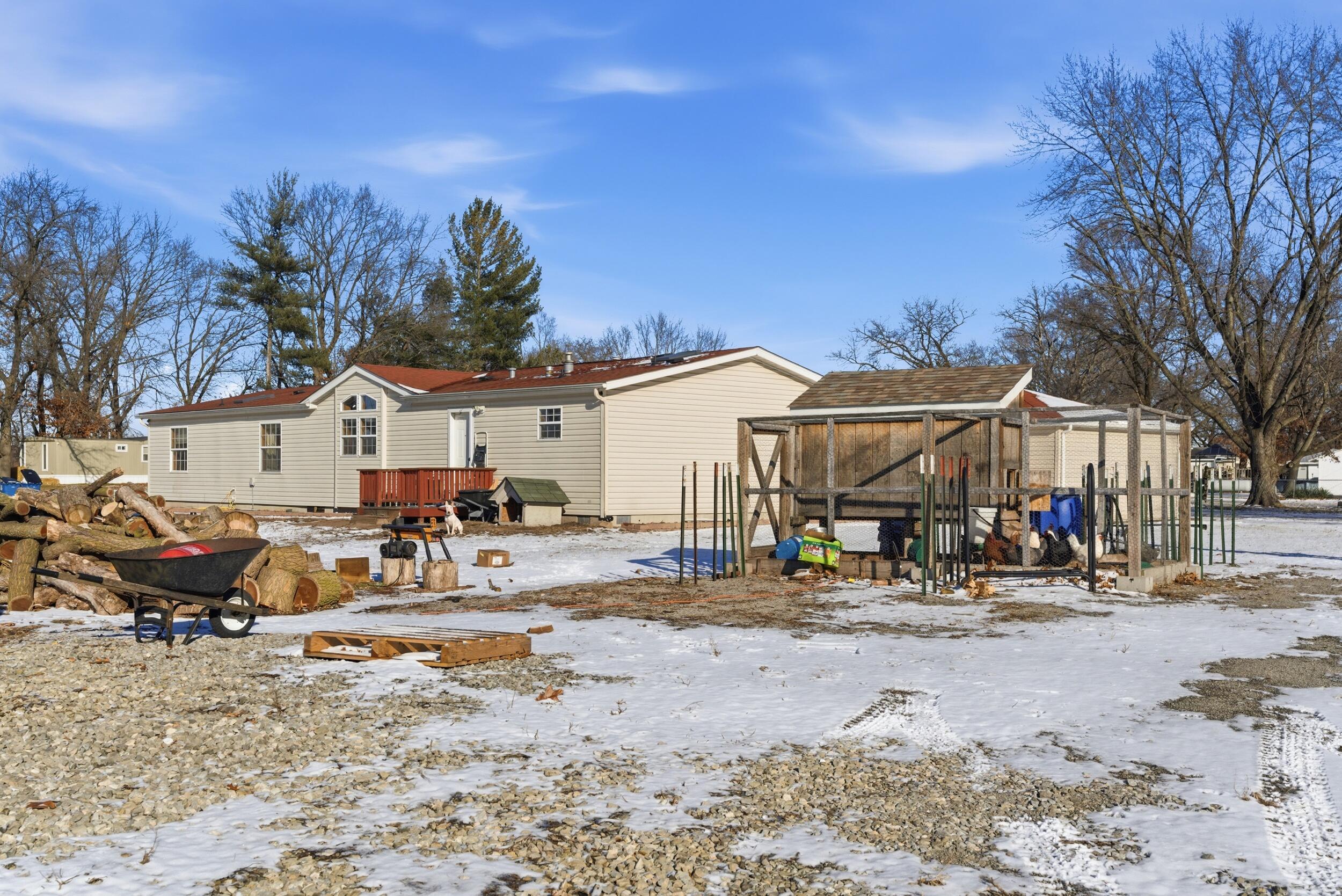 4827 East 994 North Demotte, IN 46310 - Photo 25 of 25 a view of a water with table and chairs under an umbrella