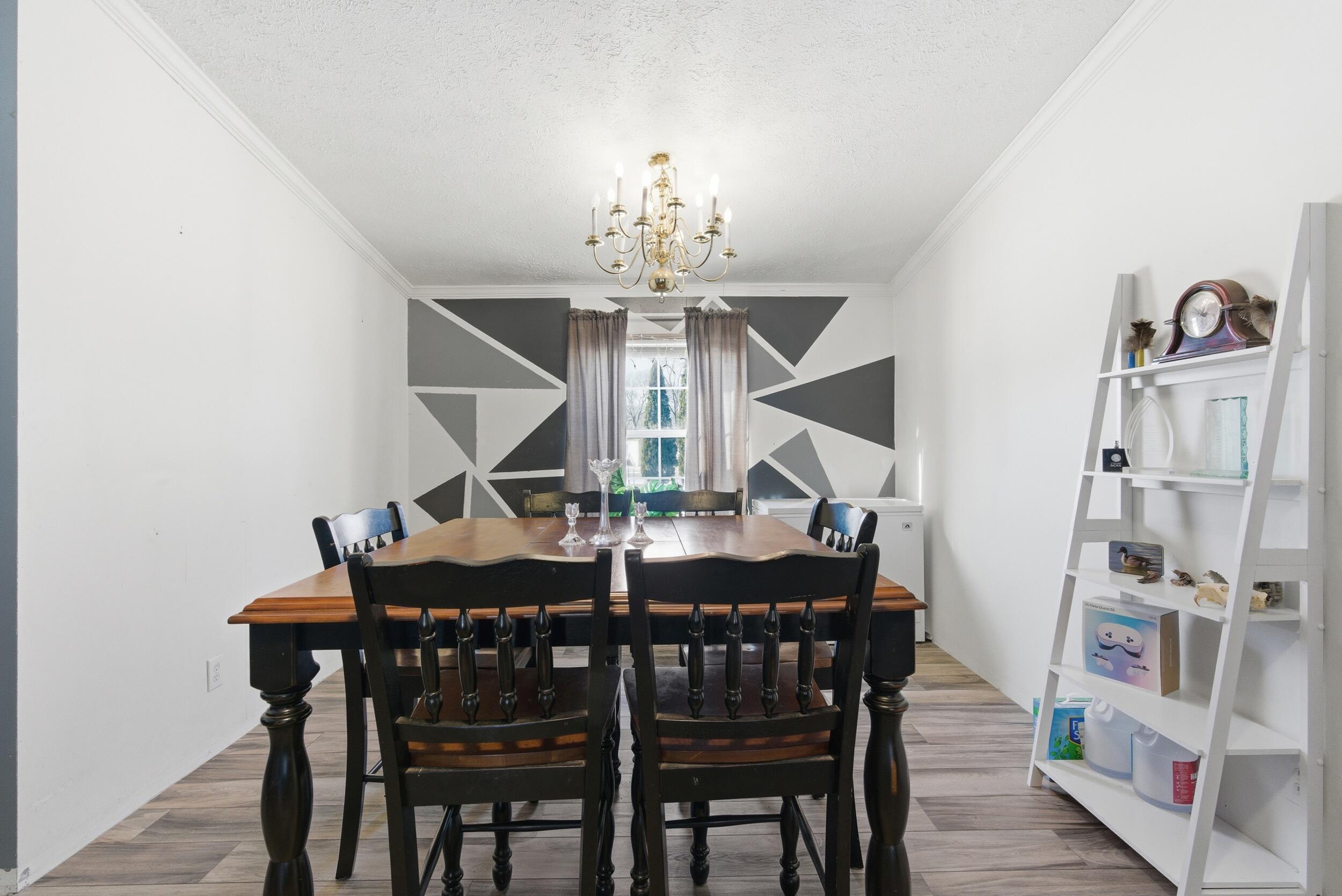 4827 East 994 North Demotte, IN 46310 - Photo 6 of 25 a view of a dining room with furniture and chandelier