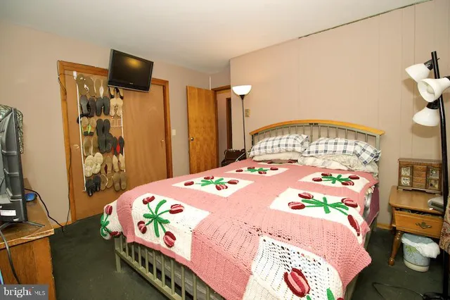 a bedroom with a bed and a table