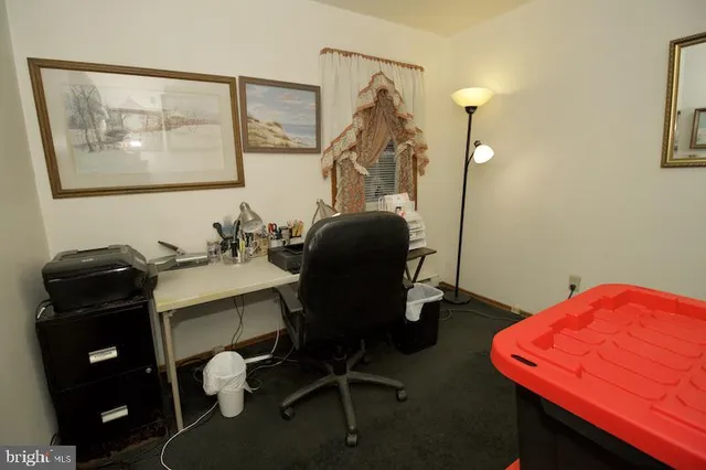 a bedroom with a bed and a mirror