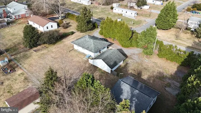 an aerial view of a house with outdoor space