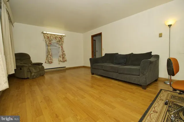 a living room with furniture and a rug