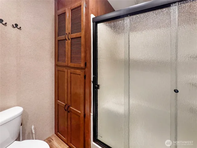 a bedroom with bed and a walk in closet