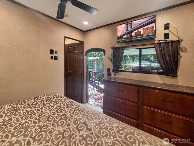 a view of a chairs and table in the balcony