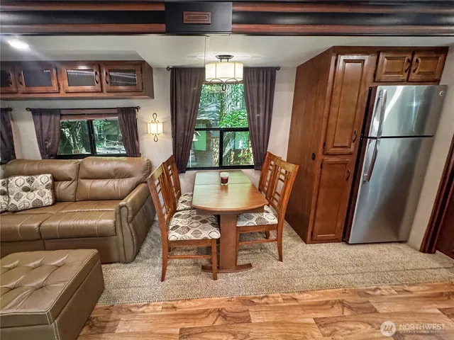 a living room with furniture fireplace and flat screen tv