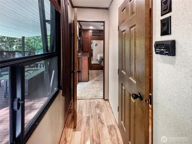 a bathroom with a granite countertop shower sink and mirror