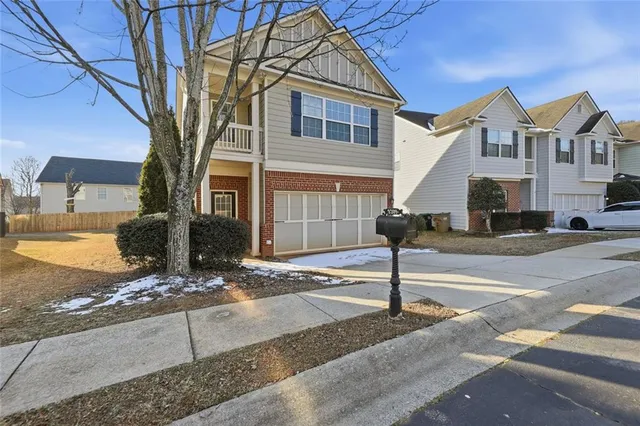 a front view of a house with street