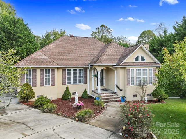 a front view of house with an outdoor space