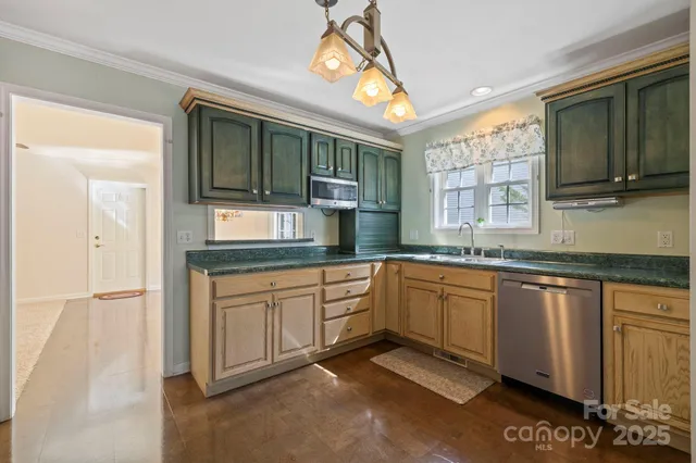 a stove top oven sitting inside of a kitchen