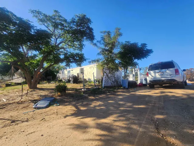 a view of a street with a building in the background