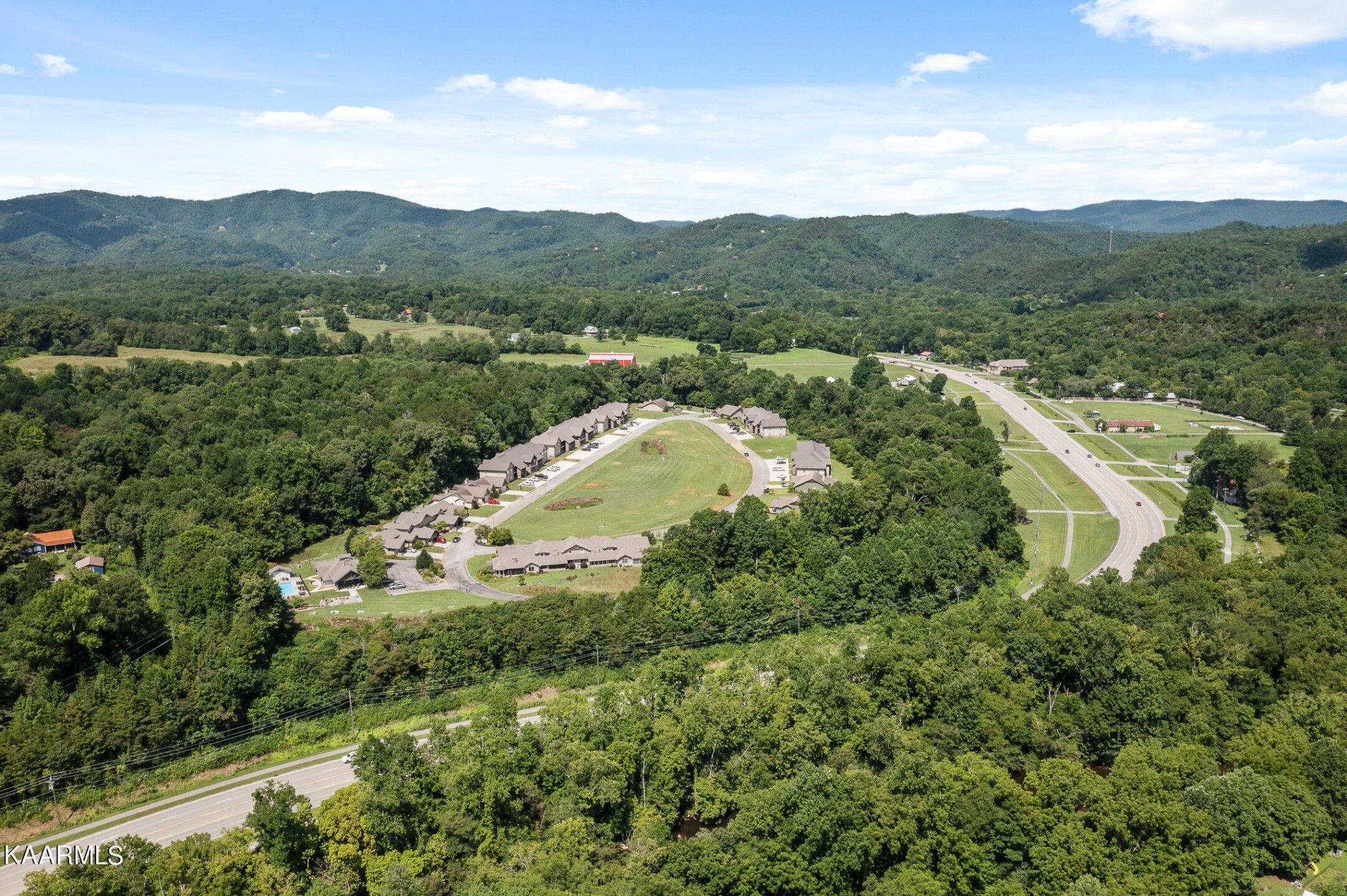 326 Shooting Star Loop, Unit 106 Townsend, TN 37882 - Photo 23 of 24 a view of a house with a mountain and a forest
