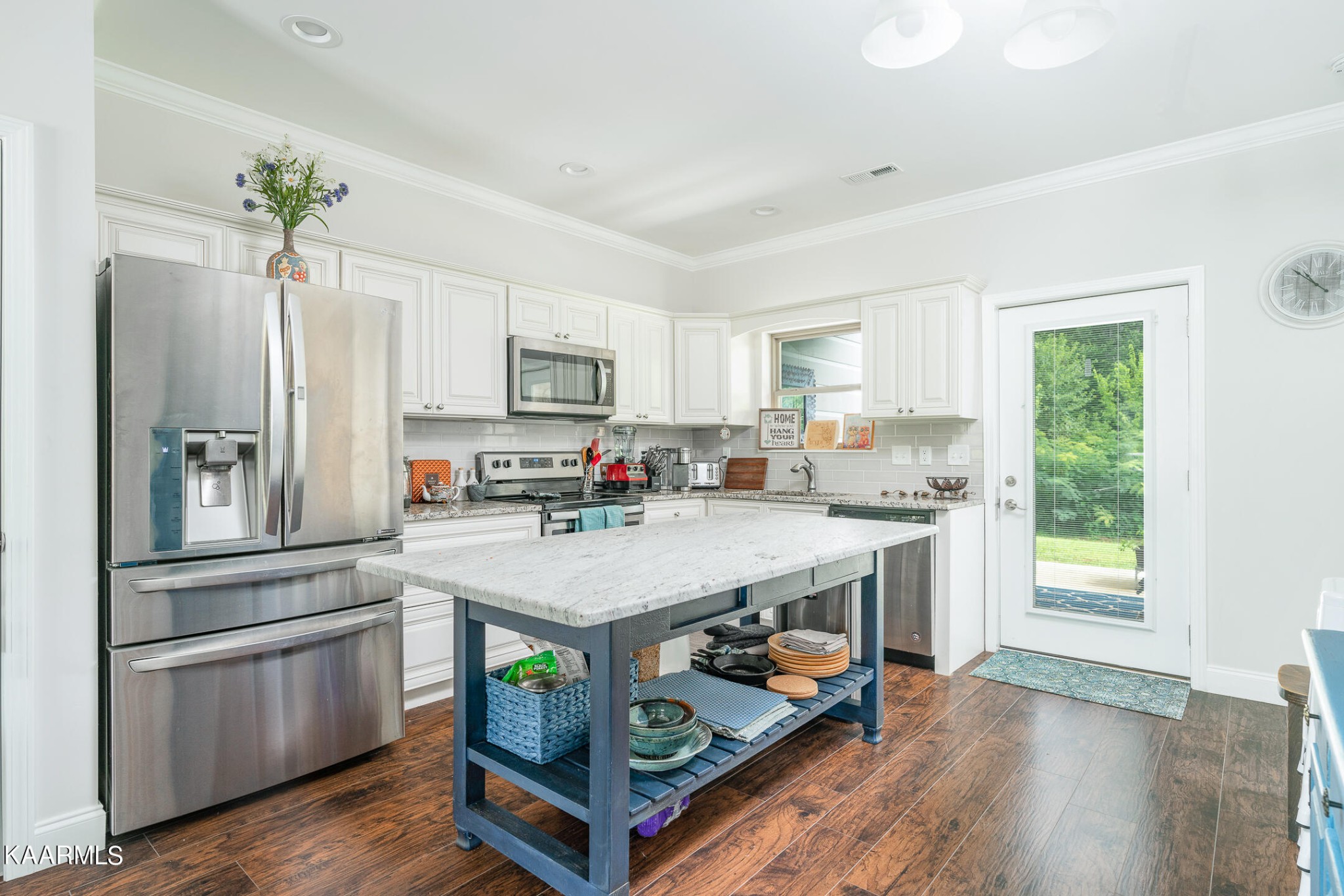 326 Shooting Star Loop, Unit 106 Townsend, TN 37882 - Photo 6 of 24 a kitchen with a sink appliances and cabinets