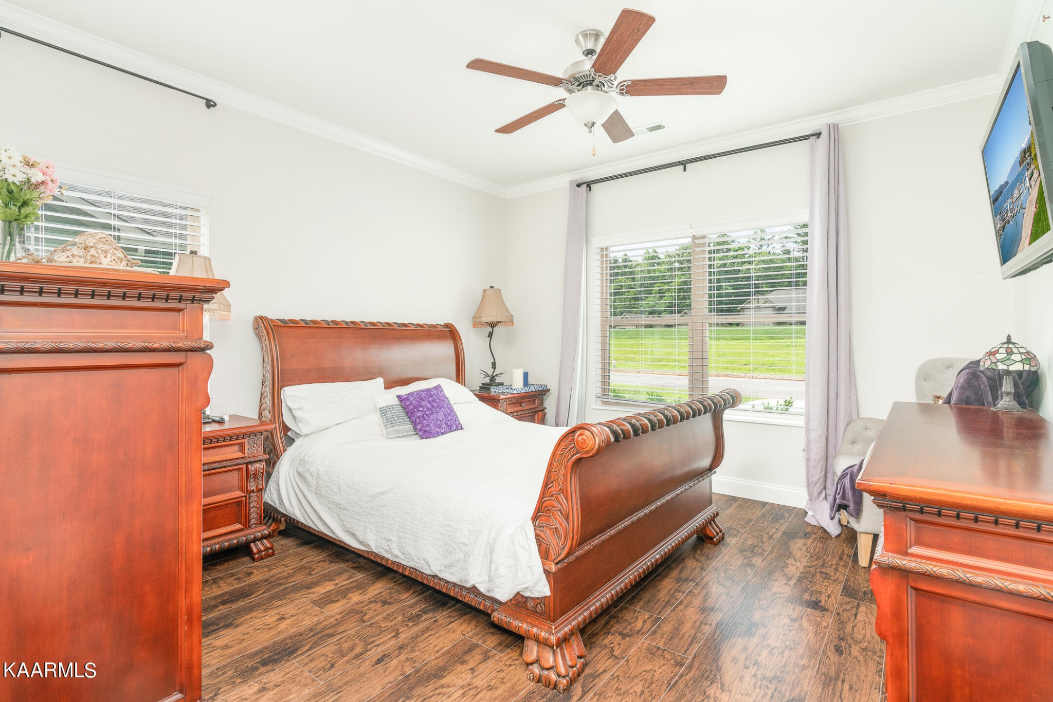326 Shooting Star Loop, Unit 106 Townsend, TN 37882 - Photo 9 of 24 a bedroom with a bed flat screen tv and a large window