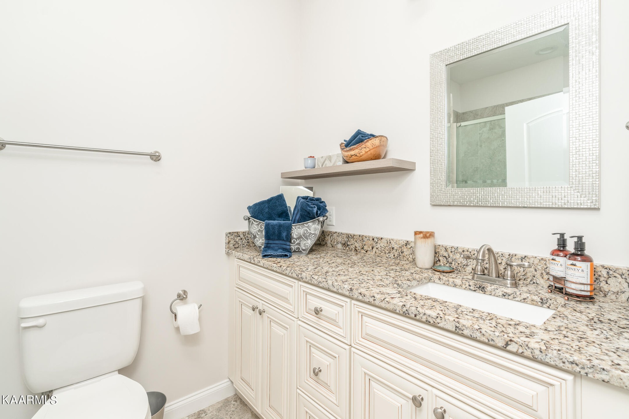 326 Shooting Star Loop, Unit 106 Townsend, TN 37882 - Photo 10 of 24 a bathroom with a granite countertop sink and a toilet