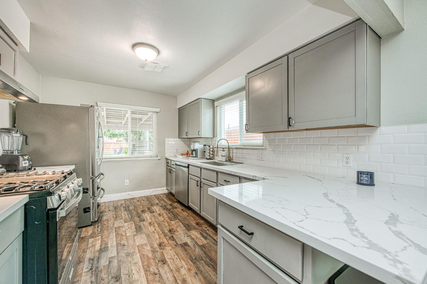 2471 Nebraska Avenue Selma, CA 93662 - Photo 12 of 29 a kitchen with a sink stove and cabinets