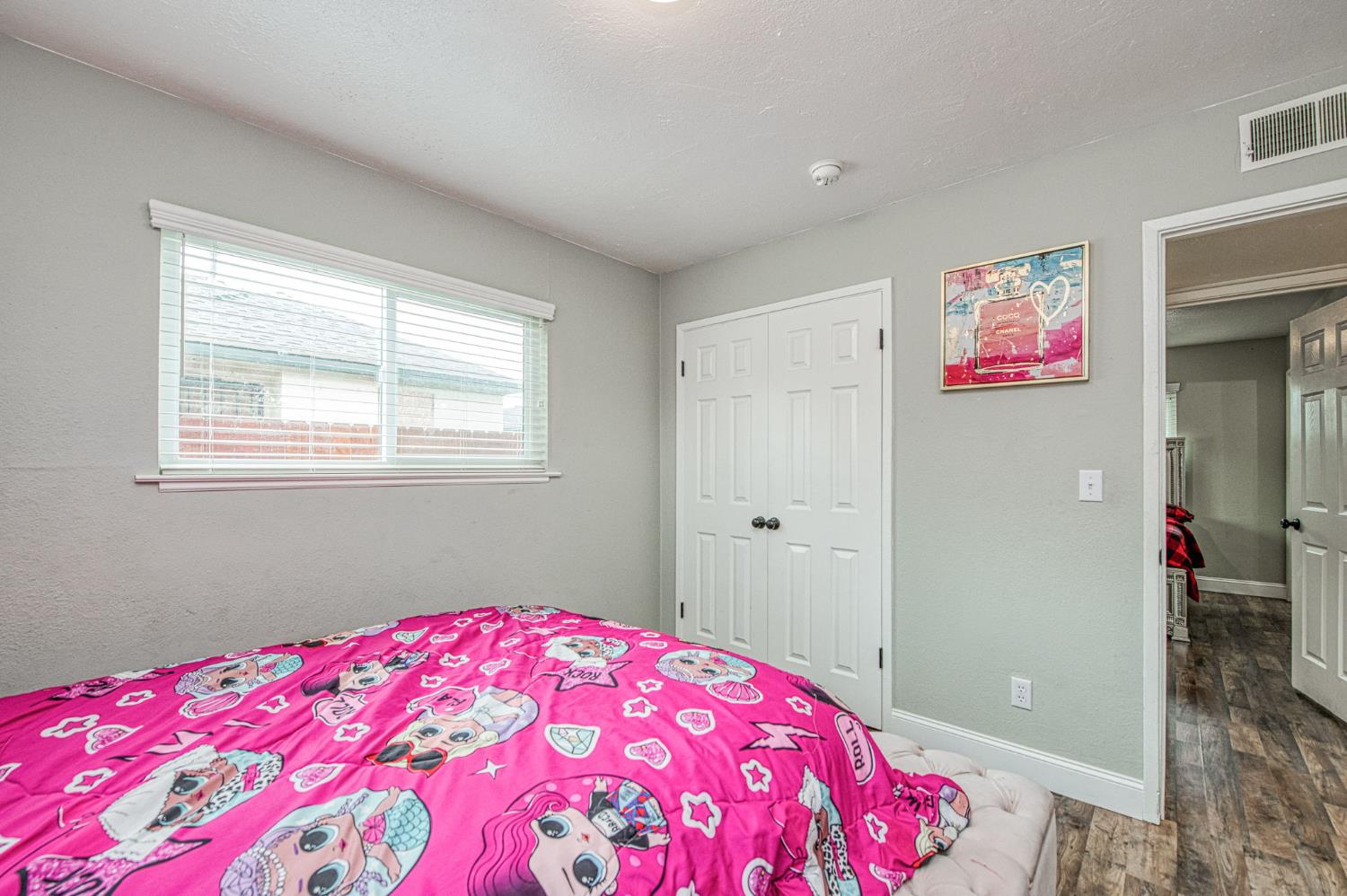 2471 Nebraska Avenue Selma, CA 93662 - Photo 18 of 29 a bedroom with a bed and a dresser