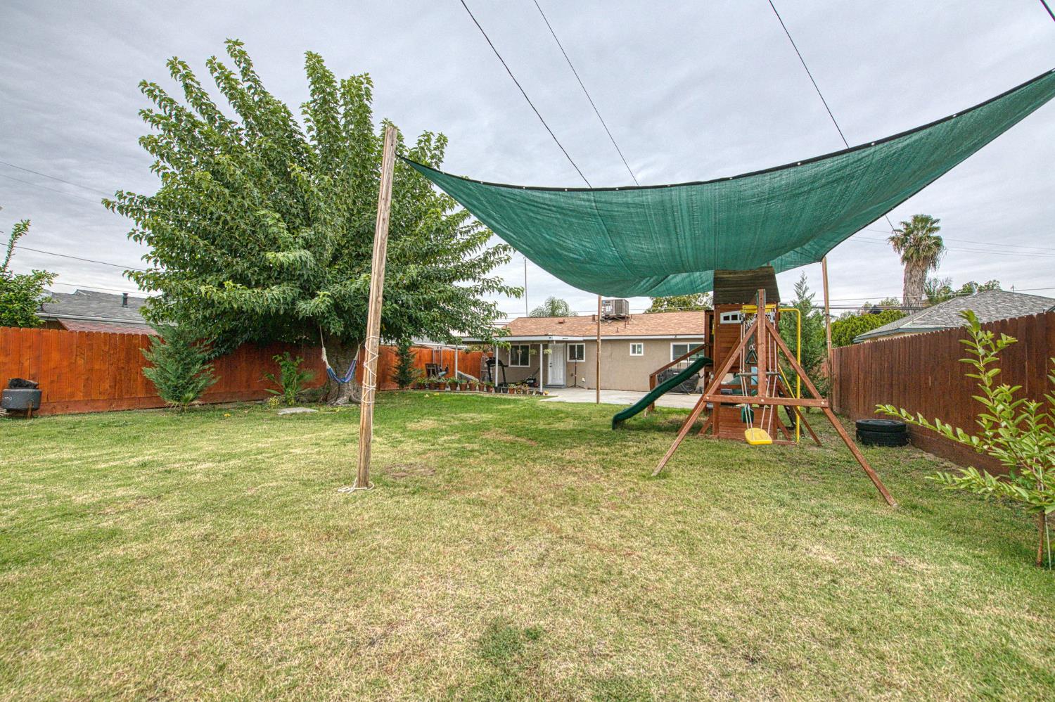 2471 Nebraska Avenue Selma, CA 93662 - Photo 26 of 29 a view of a house with a yard