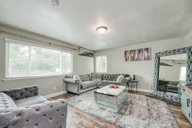 a bedroom with furniture and a window