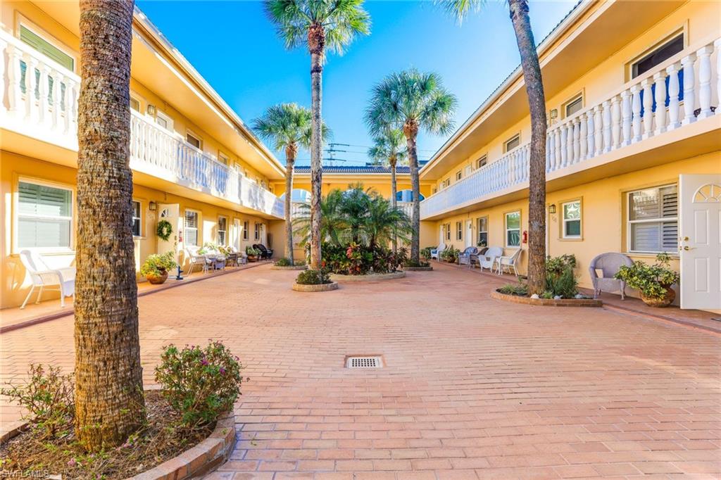 980 7th Avenue South, Unit 101 Naples, FL 34102 - Photo 25 of 32 a view of a building with a street