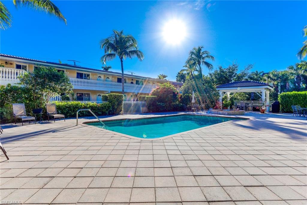 980 7th Avenue South, Unit 101 Naples, FL 34102 - Photo 28 of 32 a view of outdoor space with trees