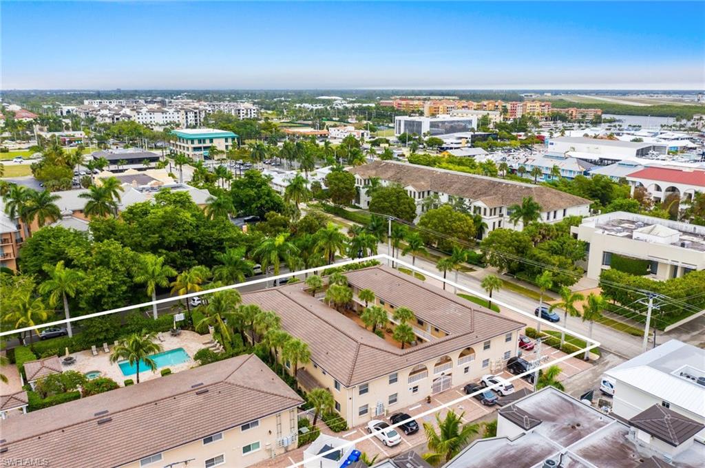980 7th Avenue South, Unit 101 Naples, FL 34102 - Photo 31 of 32 an aerial view of residential houses with outdoor space