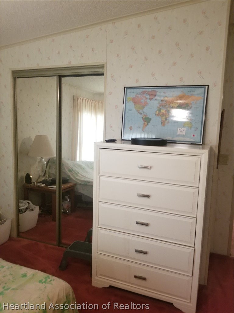9125 Spur Path Sebring, FL 33875 - Photo 13 of 31 Master bedroom