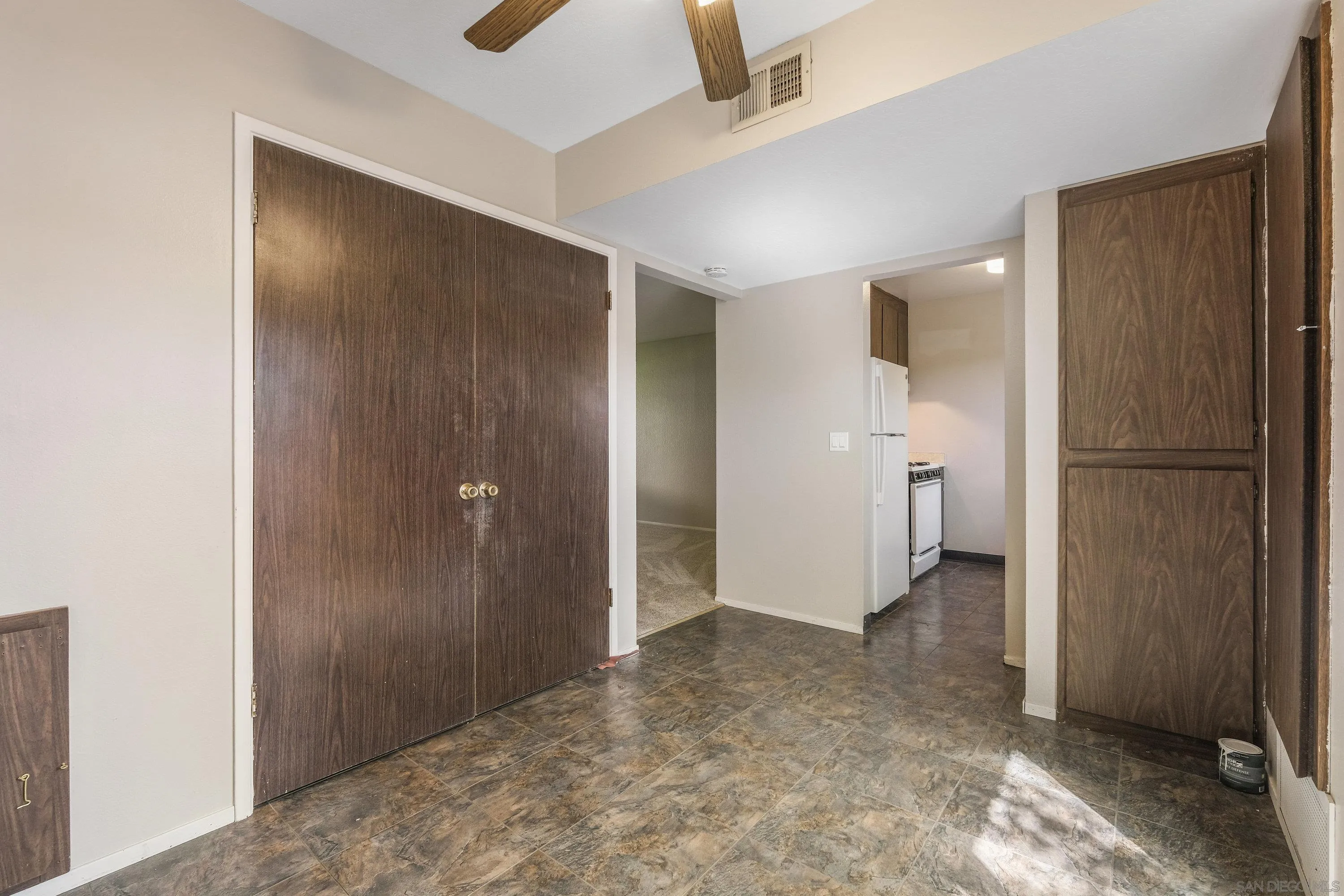 379 Eldridge Avenue Vacaville, CA 95688 - Photo 9 of 19 a view of a room with a refrigerator and a sink
