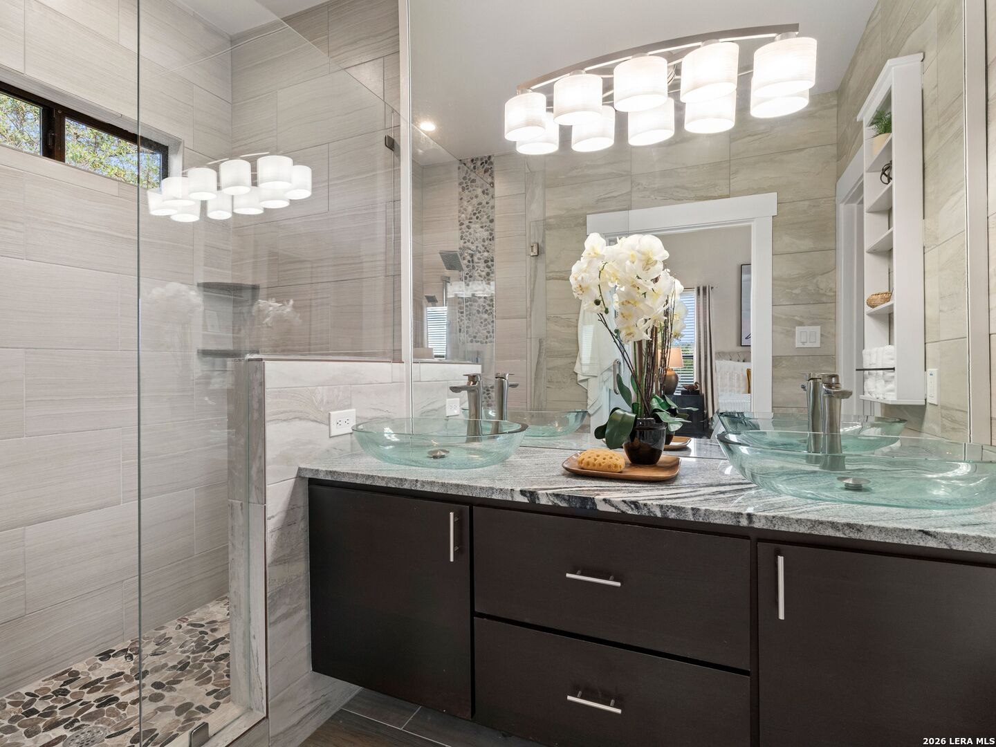1146 Victoria Avenue Spring Branch, TX 78070 - Photo 29 of 89 a bathroom with a sink and mirror