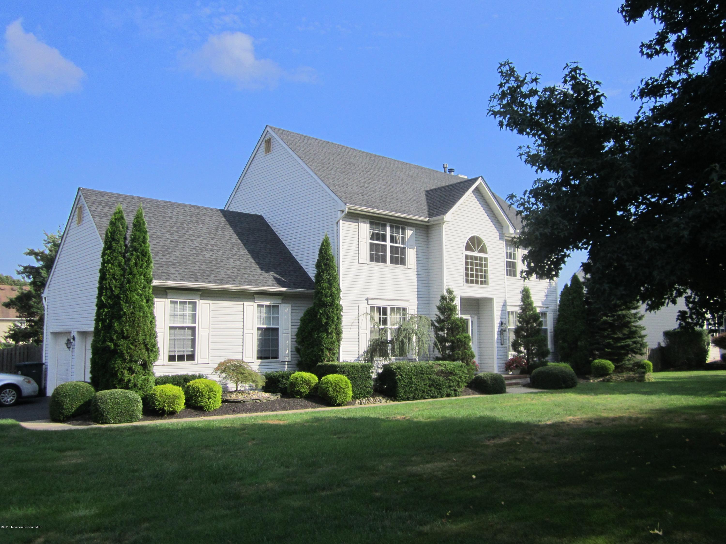 103 Valley Road Jackson, NJ 08527 - Photo 2 of 31 a front view of a house with a yard and garage