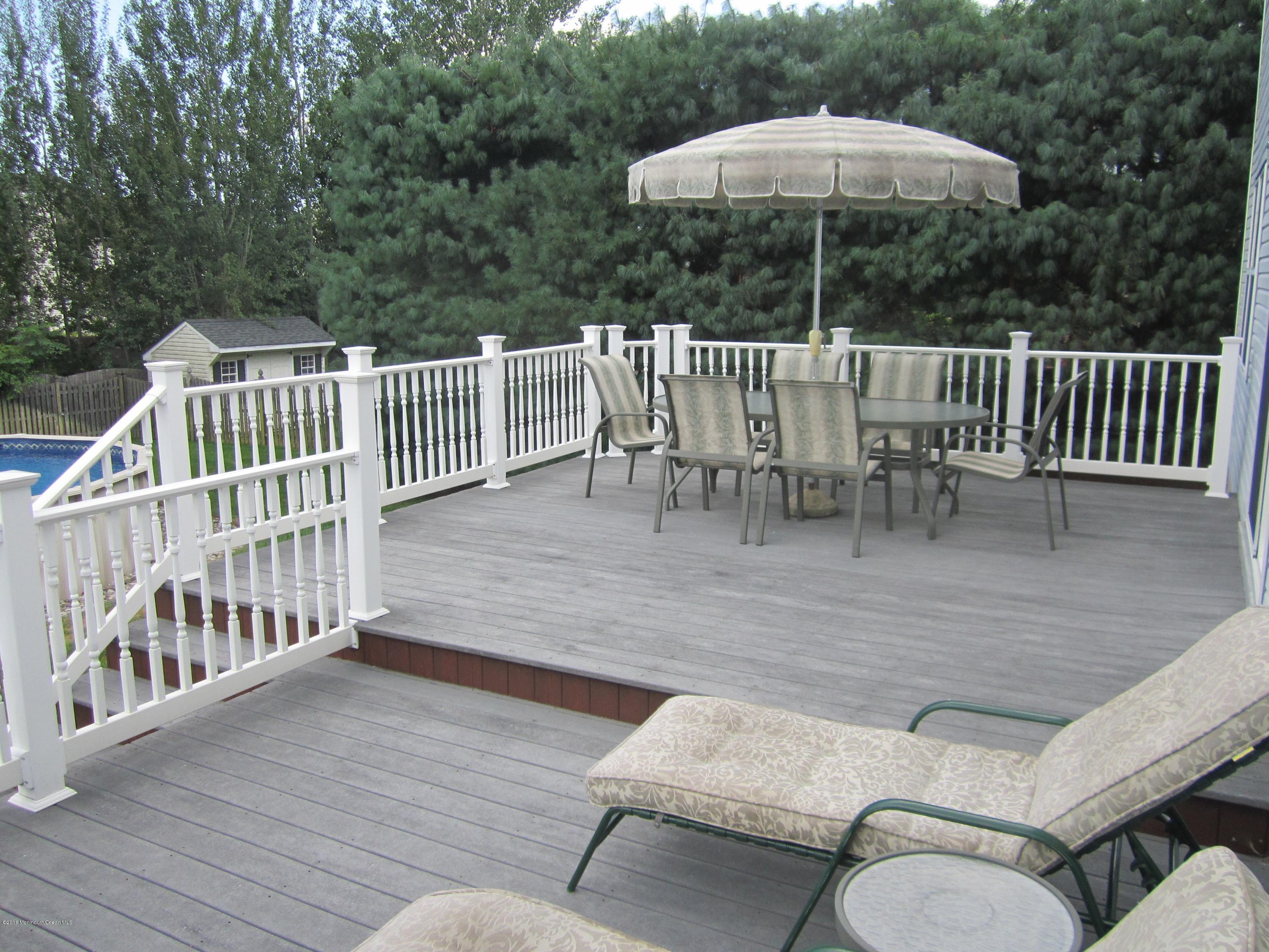 103 Valley Road Jackson, NJ 08527 - Photo 26 of 31 a view of a chairs and table on the wooden deck