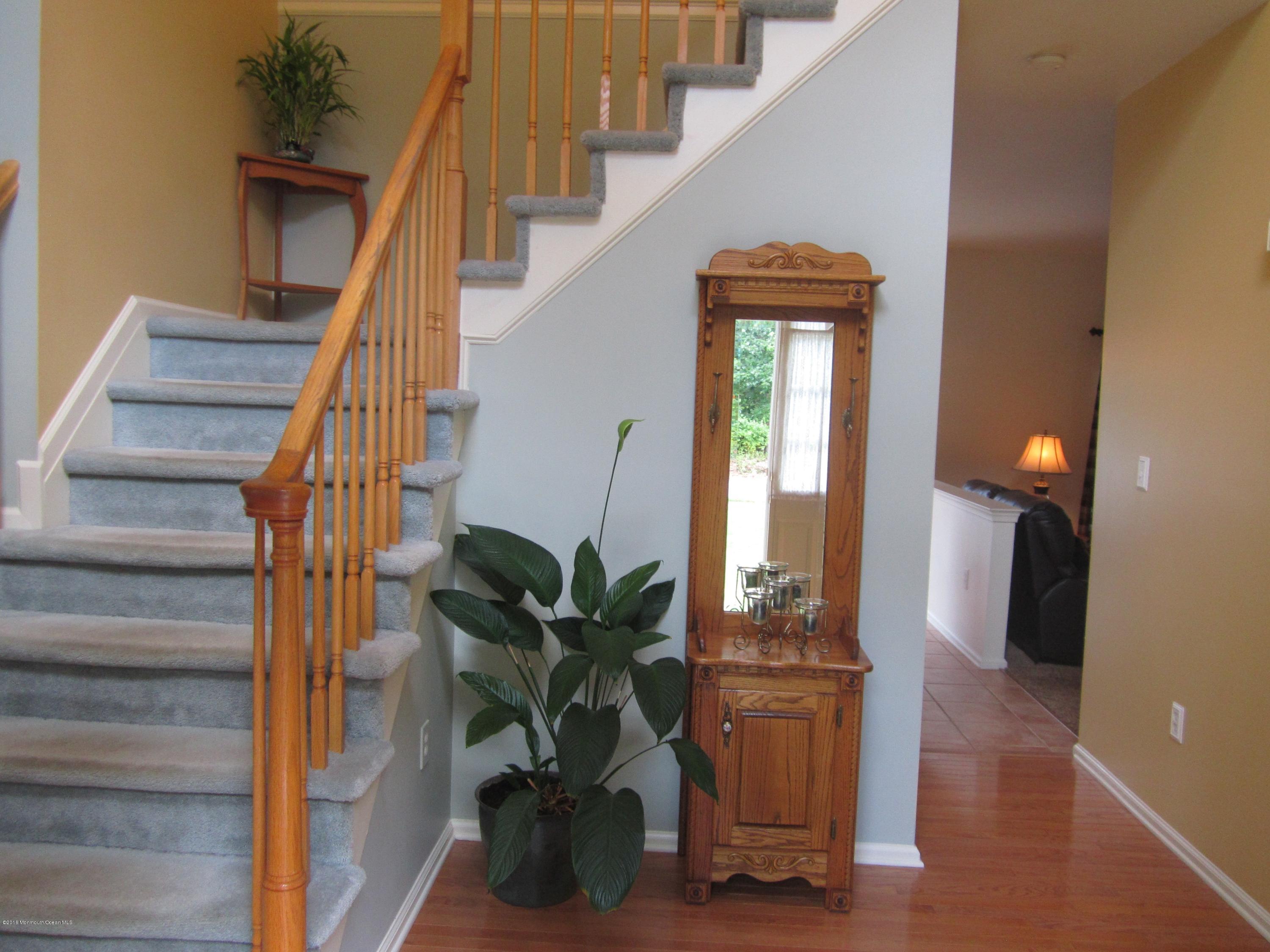 103 Valley Road Jackson, NJ 08527 - Photo 3 of 31 a view of entryway with wooden floor and a potted plant