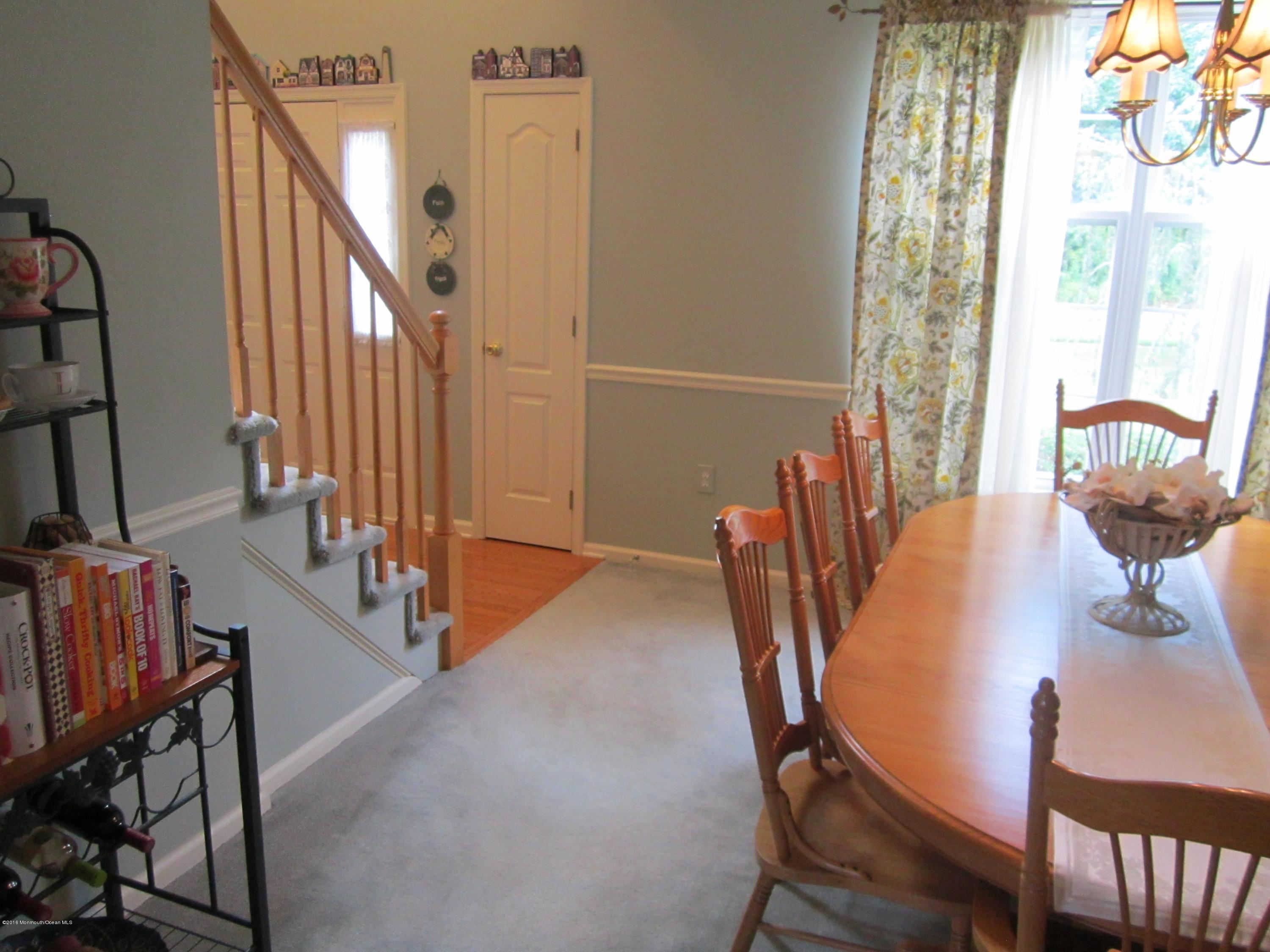 103 Valley Road Jackson, NJ 08527 - Photo 5 of 31 a view of a dining room with furniture and a potted plant